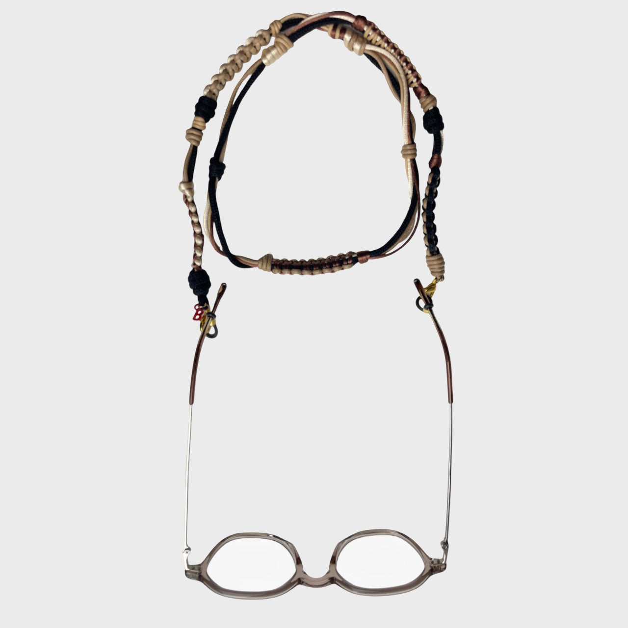 Woven eyeglass holder with Beige, Brown and black details on a white background