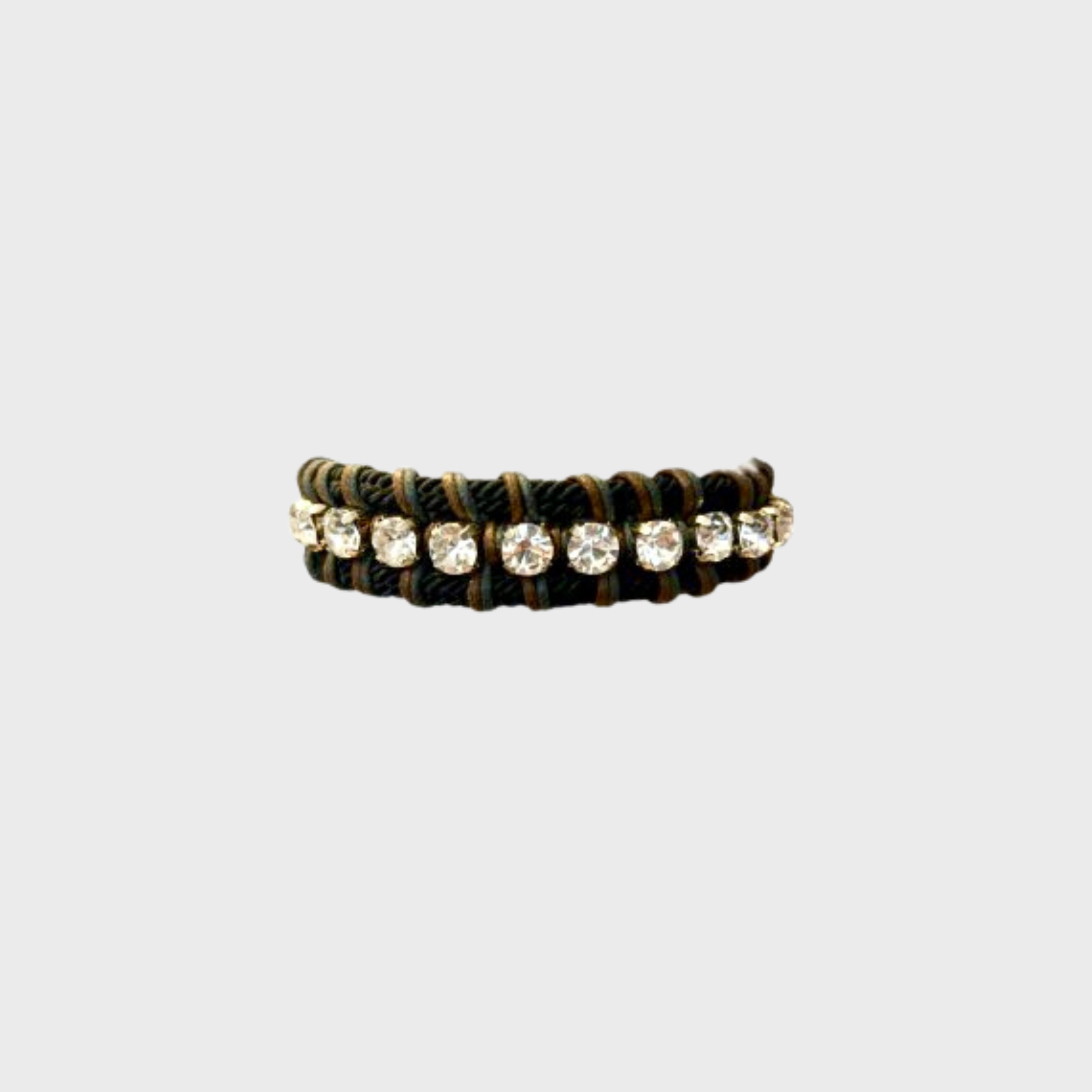 A braided macramé collar featuring black, blue and brown cords with small diamond beads and a silver clasp.