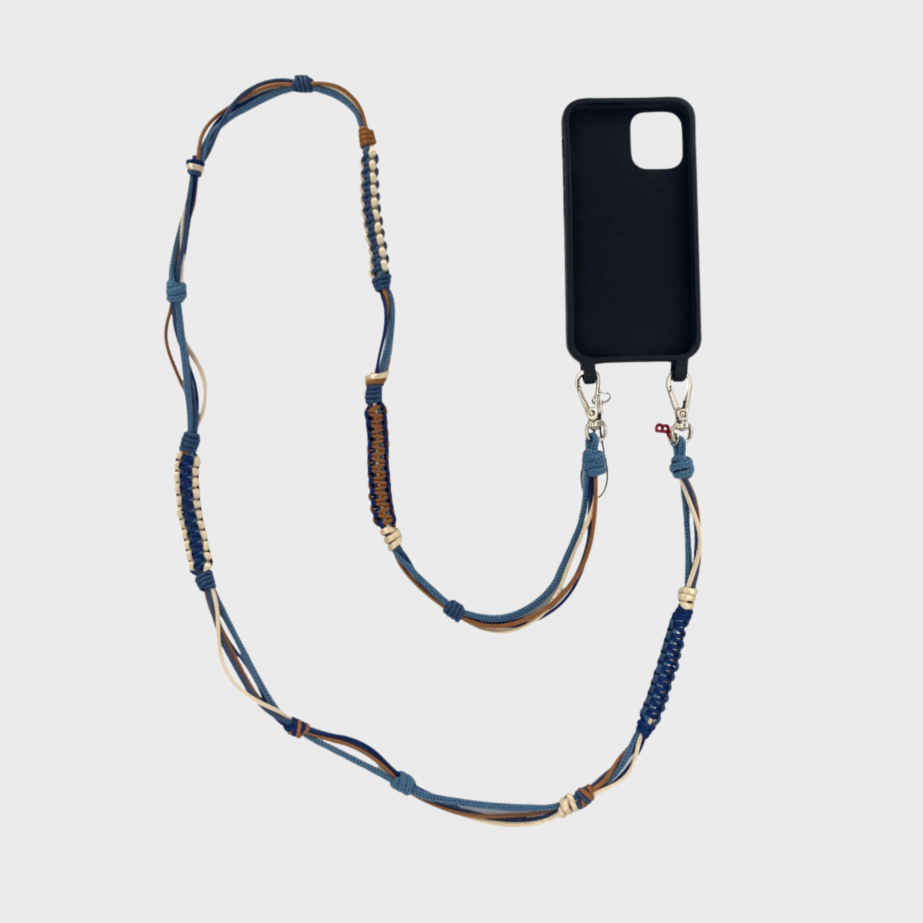 Brown, blue and beige macramé woven phone lanyard with a black phone case on a white background.