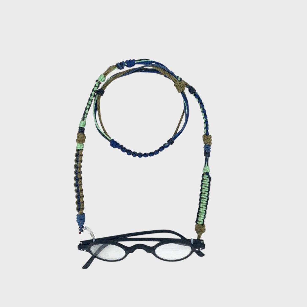 breaded eyeglass holder with glasses on a light gray background