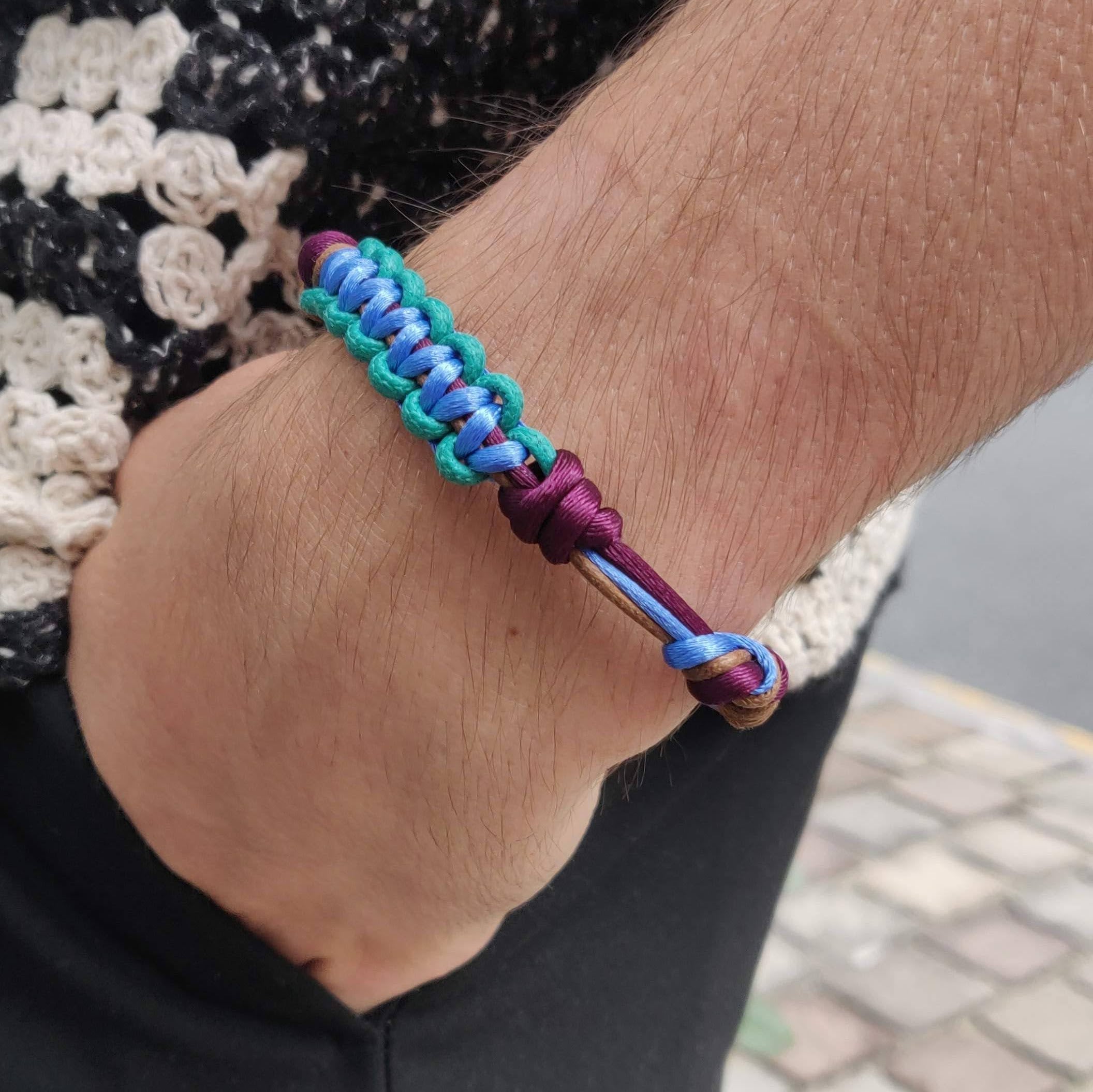 A model wearing the blue, green, purple and brown Nino bracelet