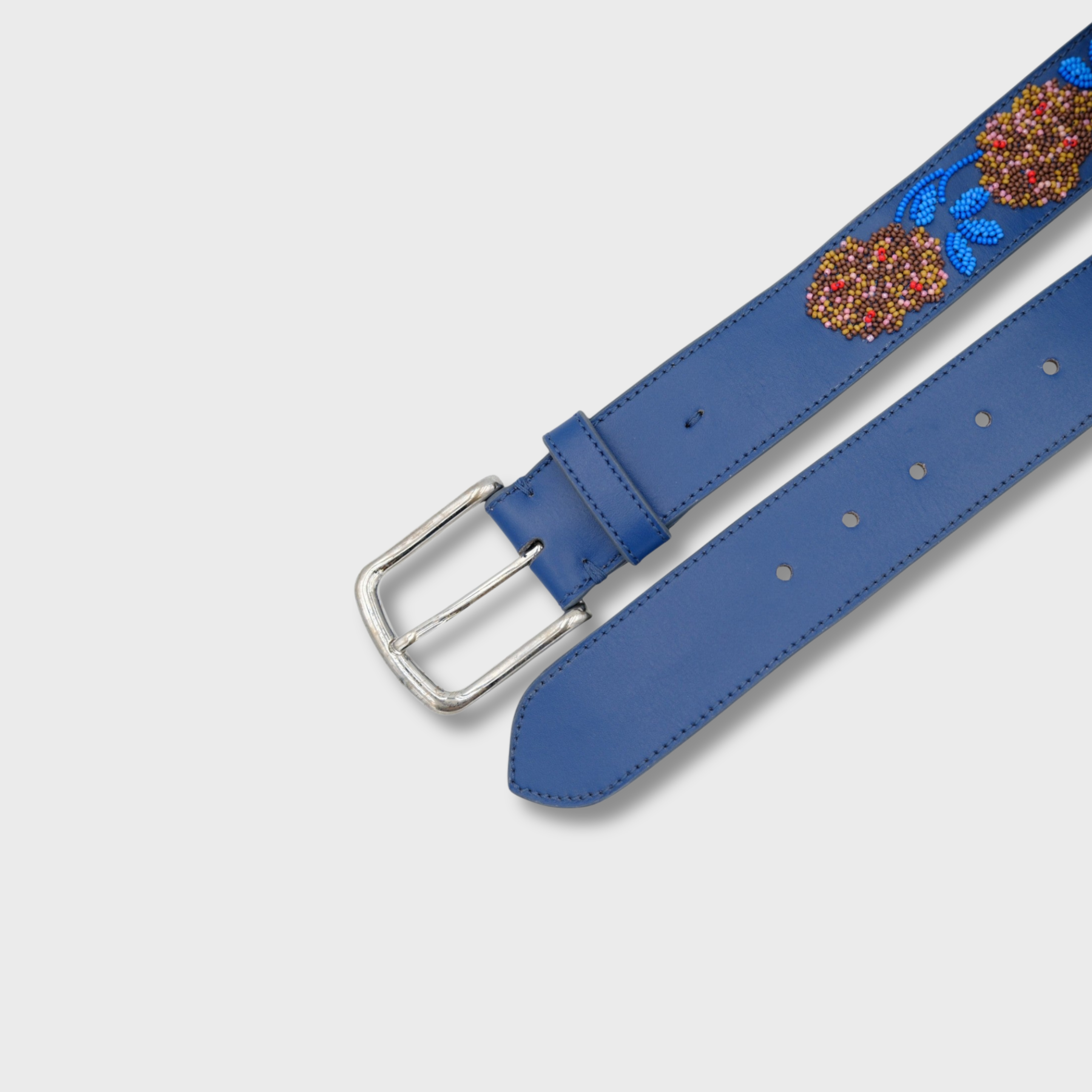 Close-up of the Blue Flower belt showing leather and bead detail