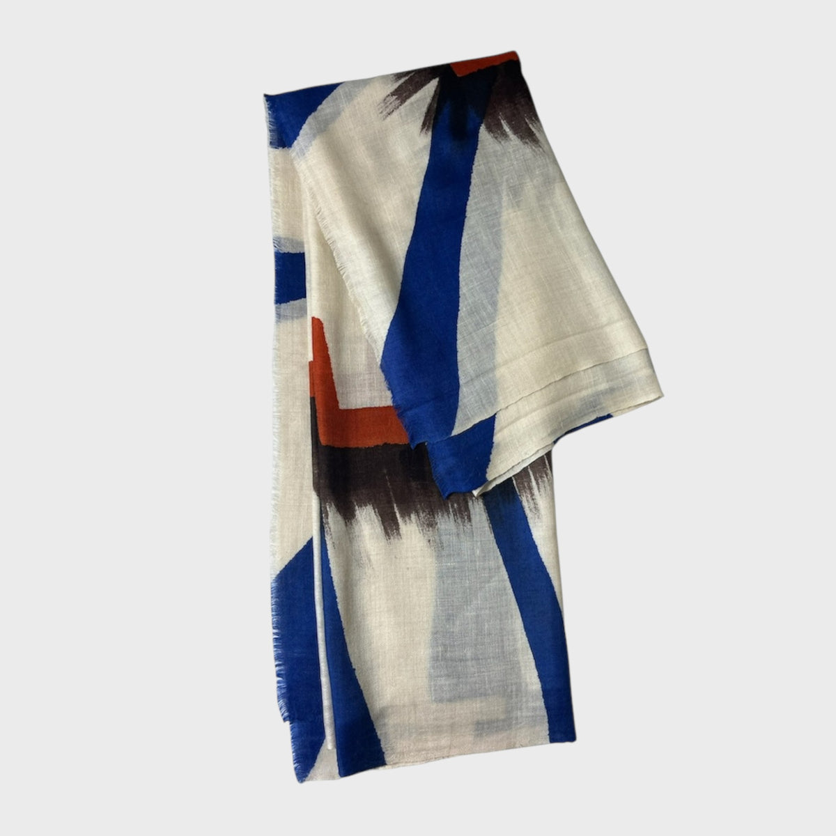 Colorful cashmere shawl with abstract pattern on a light gray background