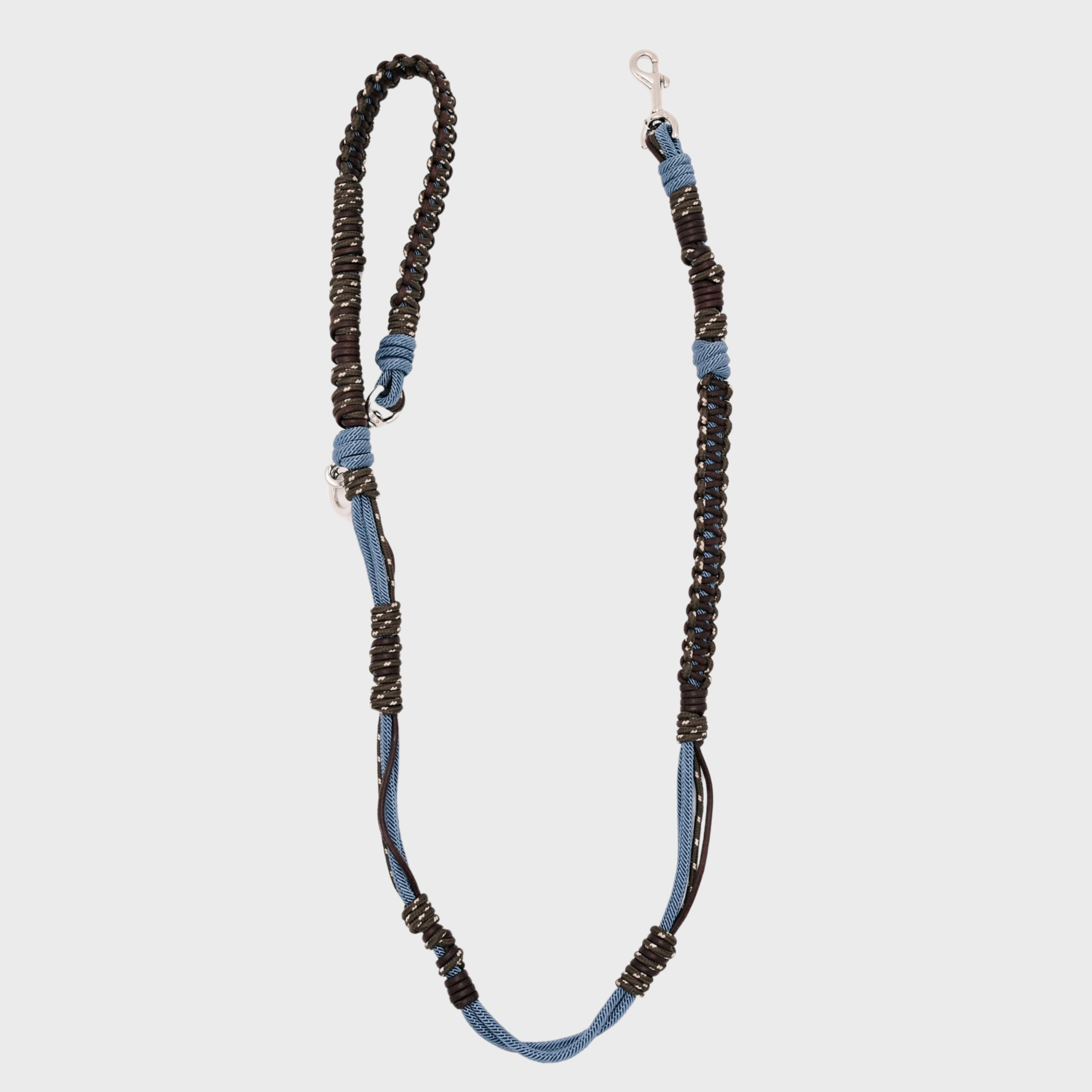 A braided macramé dog leash with blue and dark brown woven sections, and a silver metal hardware