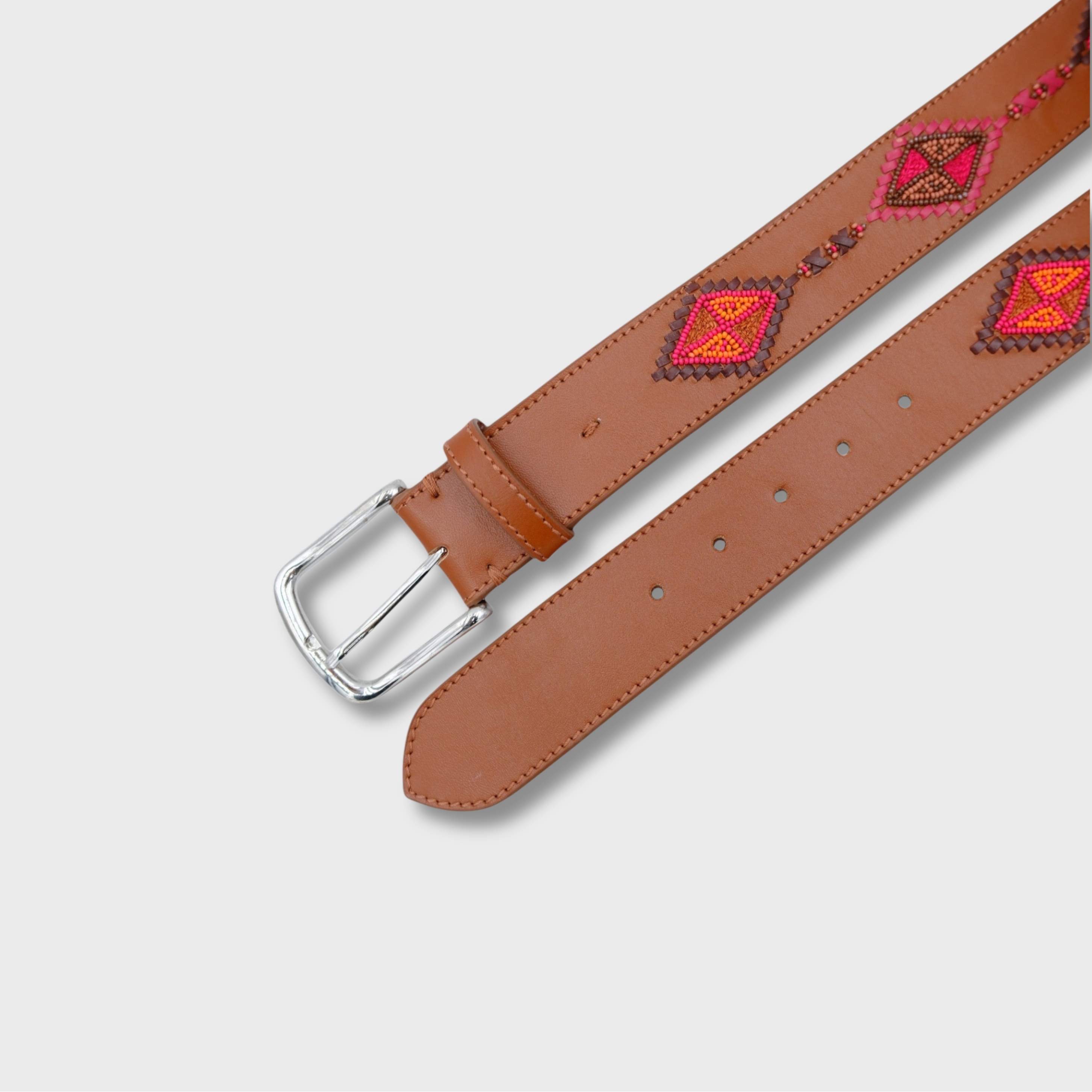 Close-up of the Cognac & Reds Cherokee belt showing leather and bead detail