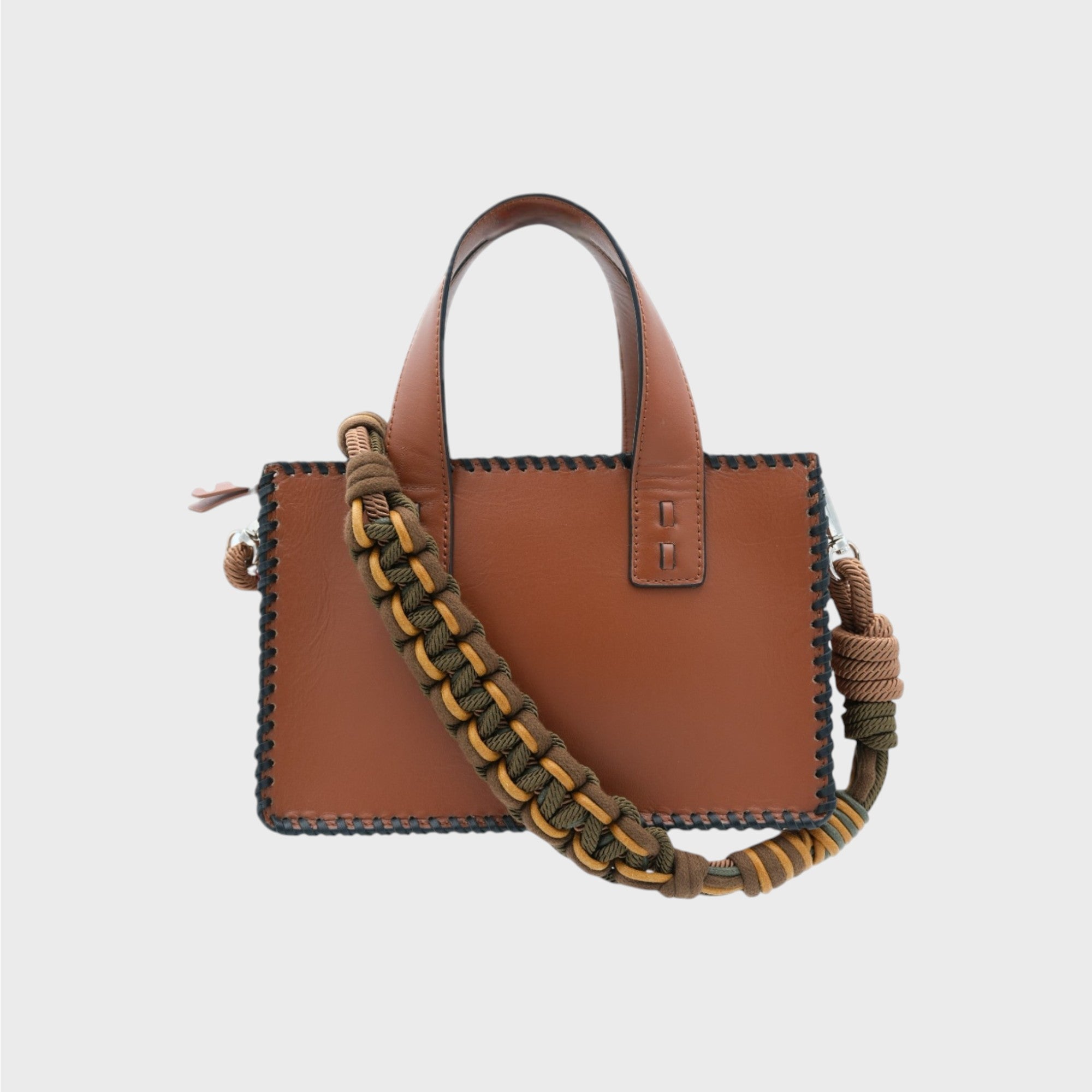 A Brown leather handbag with black details on the side and a green and yellow beaded strap.
