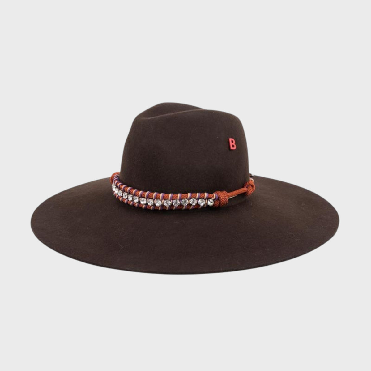 Brown velvet hat with decorative band and 'B' logo on a light gray background