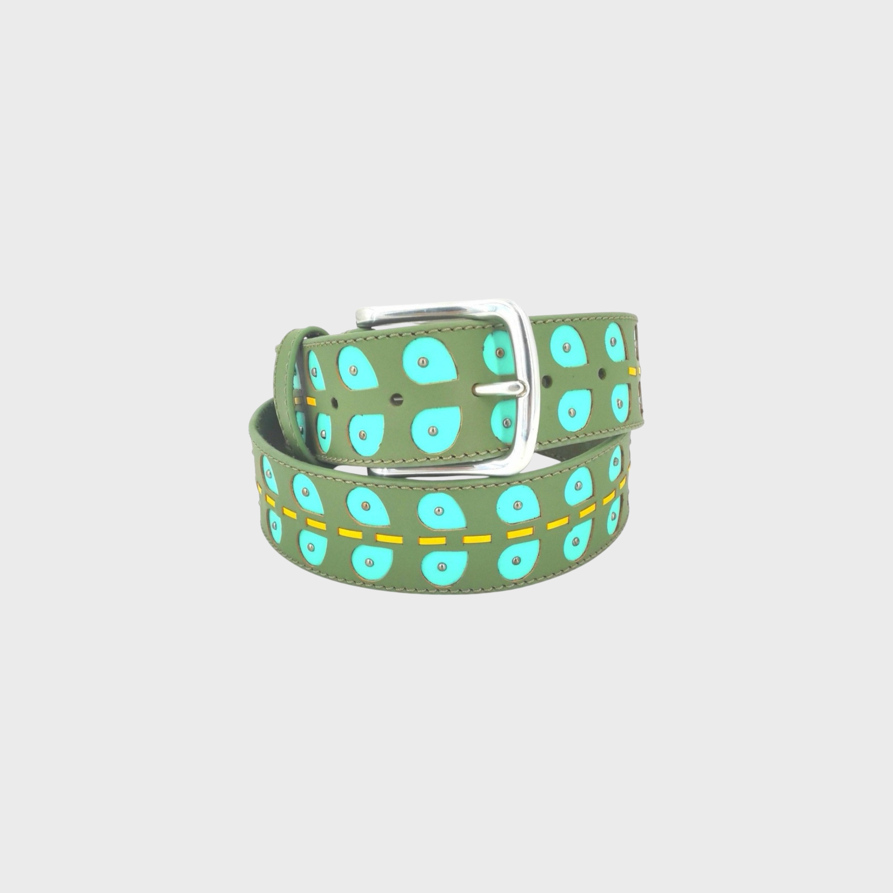 An olive green leather belt with a silver buckle, decorated with a repeating pattern of turquoise leaves and a yellow dashed line, coiled on a light gray background.