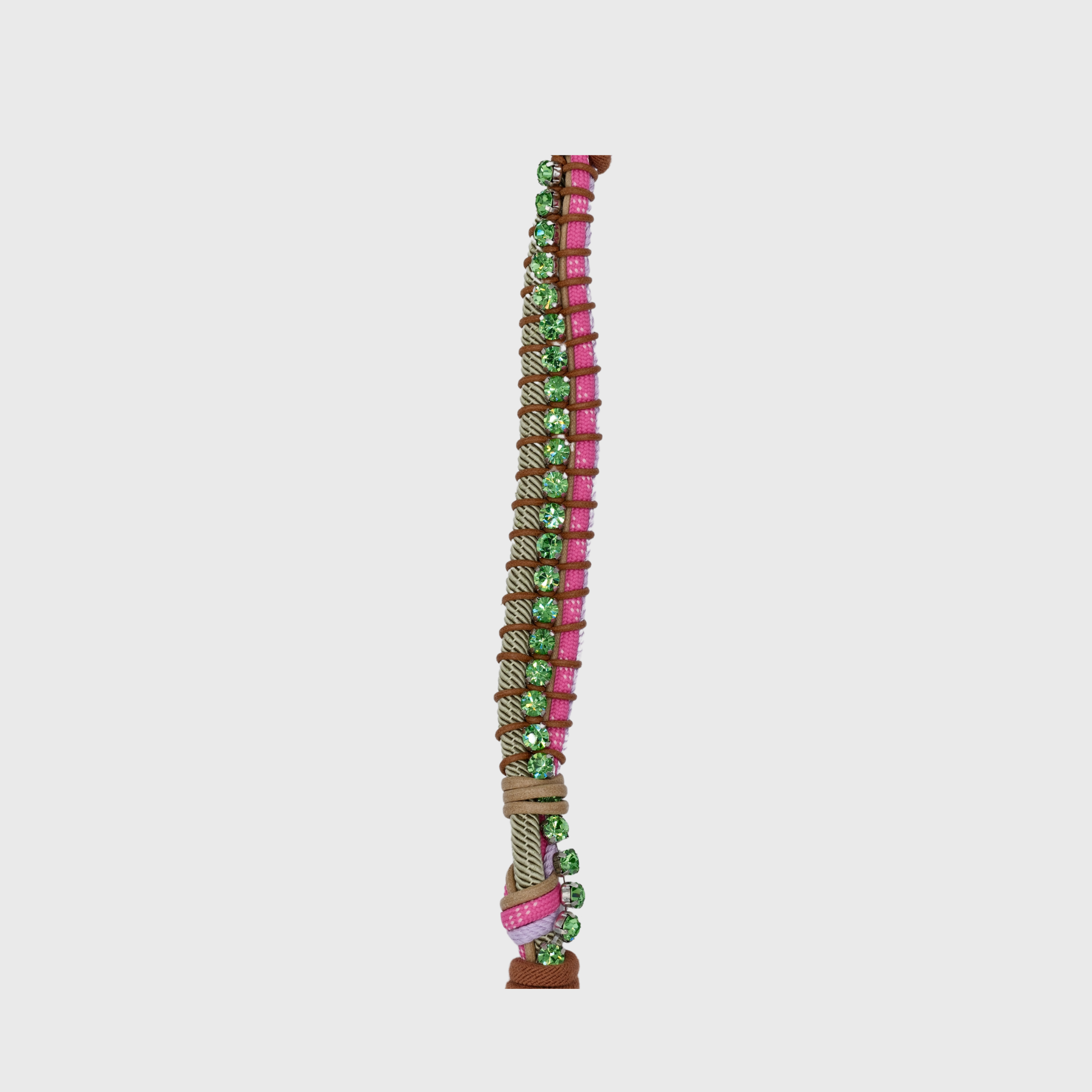 Multicolored braided macramé bag strap in pink and green, featuring some green colored beads and shown on a light grey background.