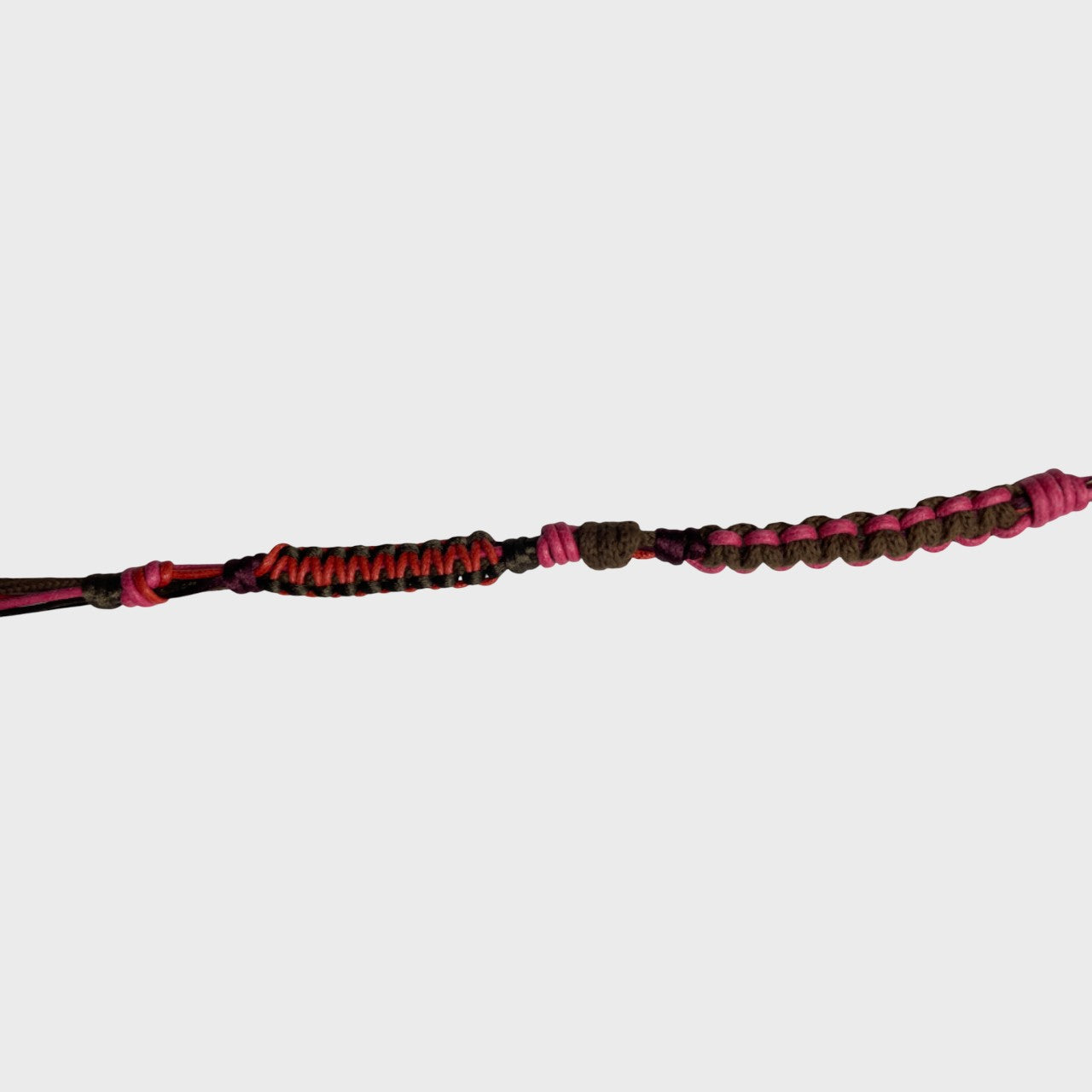 Eyeglasses holder with brown, pink and red woven pattern on a white background
