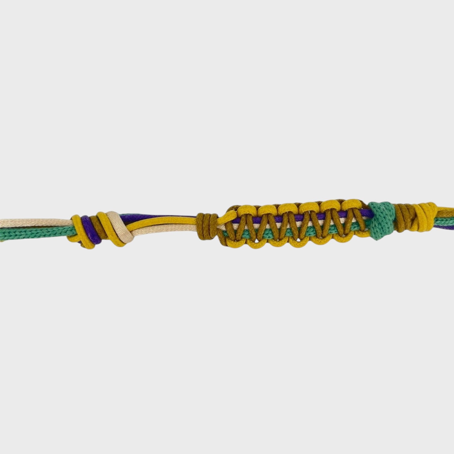 yellow, purple, beige and green woven eyeglasses holder on a white background