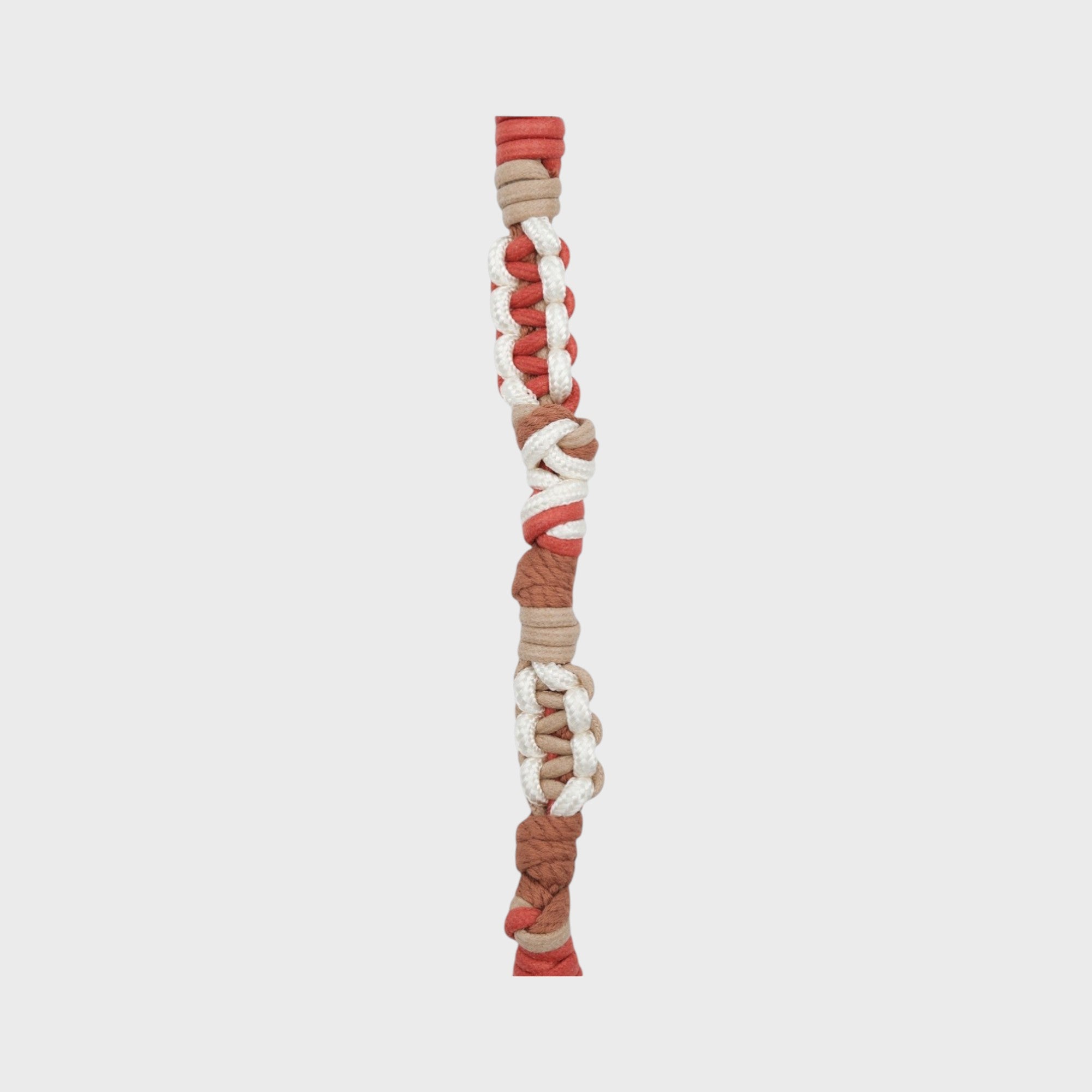 A braided macramé cord collar in shades of red, white and brown with a silver clasp