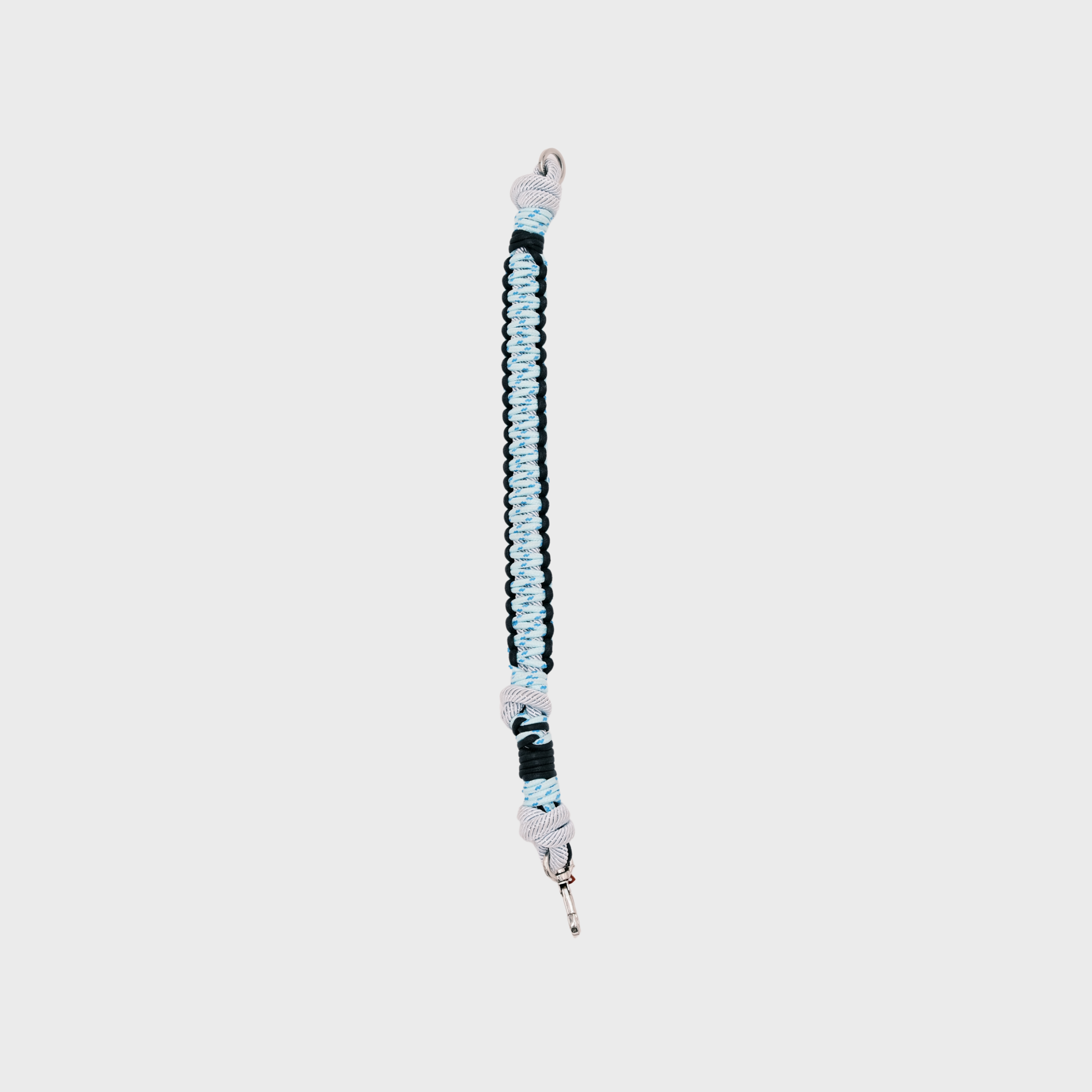 A dark and light blue braided dog collar with light blue knotted accents and a metal clip