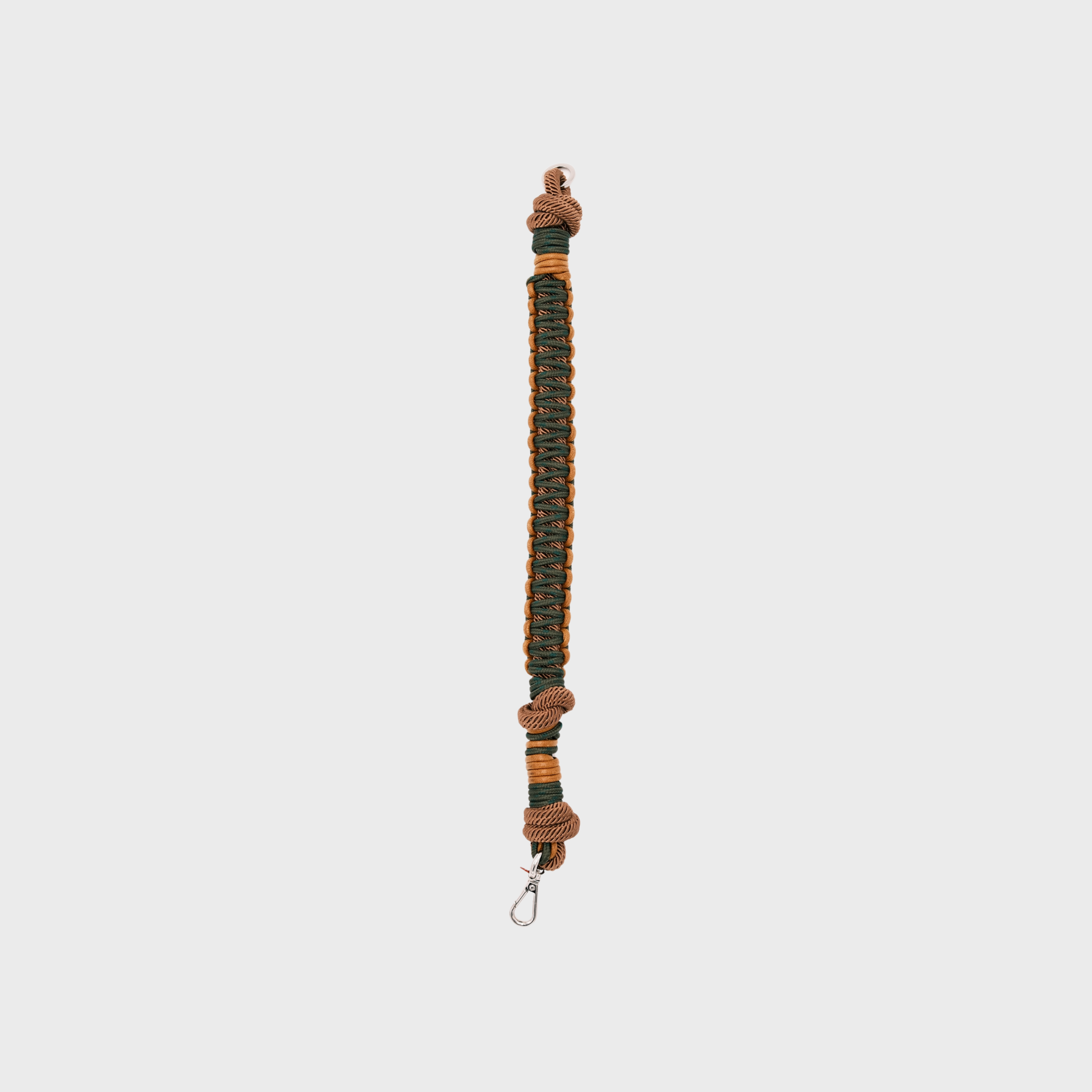 A dark green and yellow braided dog collar with light blue knotted accents and a metal clip