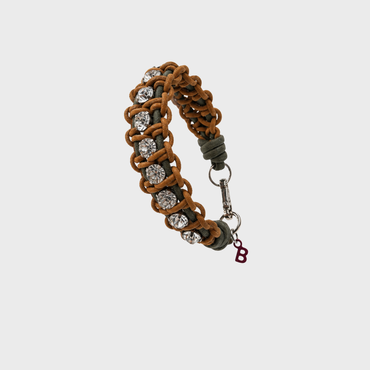 A handmade macramé woven bracelet featuring a mix of brown, and green threads, accented with small white beads and a silver clasp.
