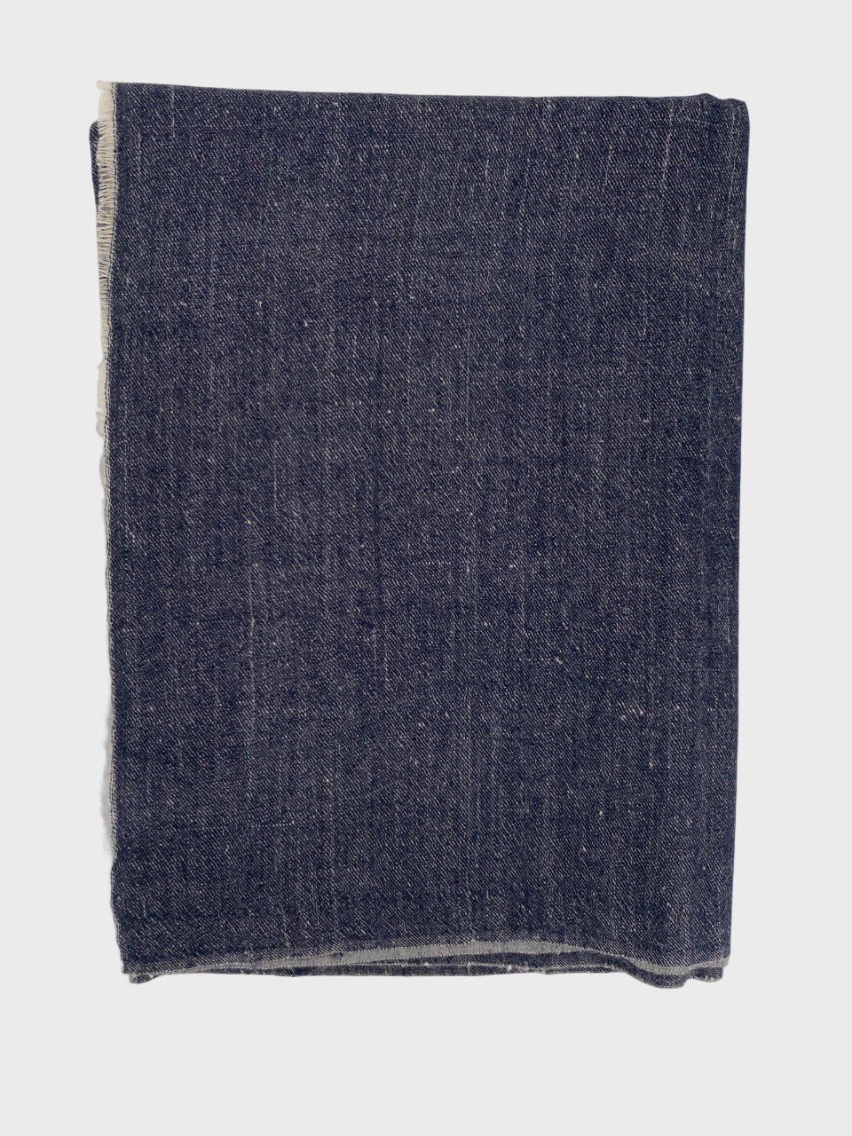 Dark blue cashmere shawl on a light gray background