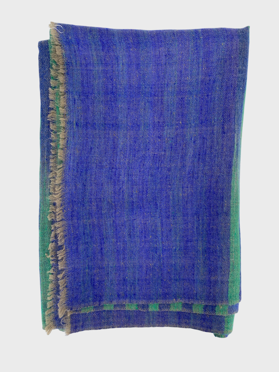 Blue and green and purple cashmere shawl on a white background