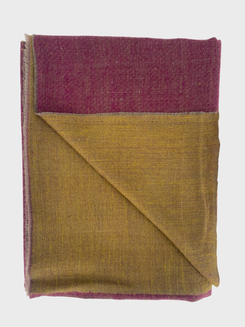 Folded cashmere shawl with purple and yellow, on a white background.