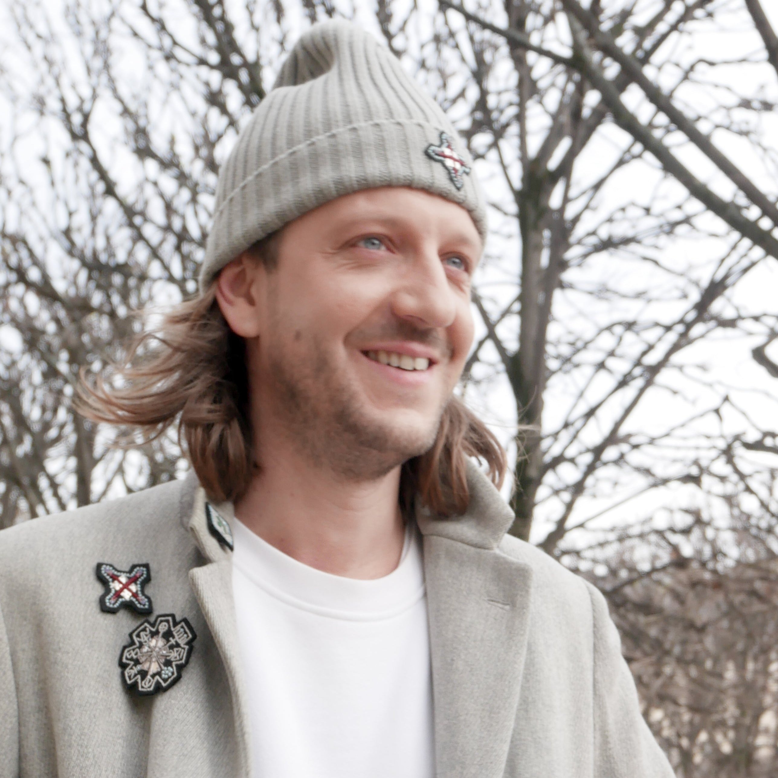 A model wearing the silver rune brooch.