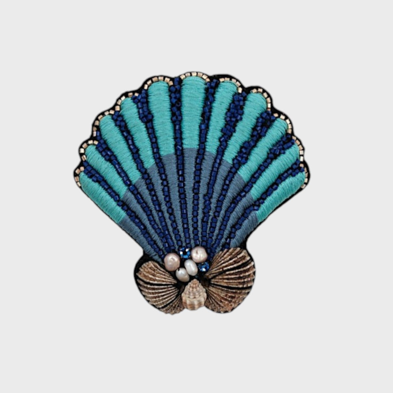 A embroidered blue shell with dark blue details.