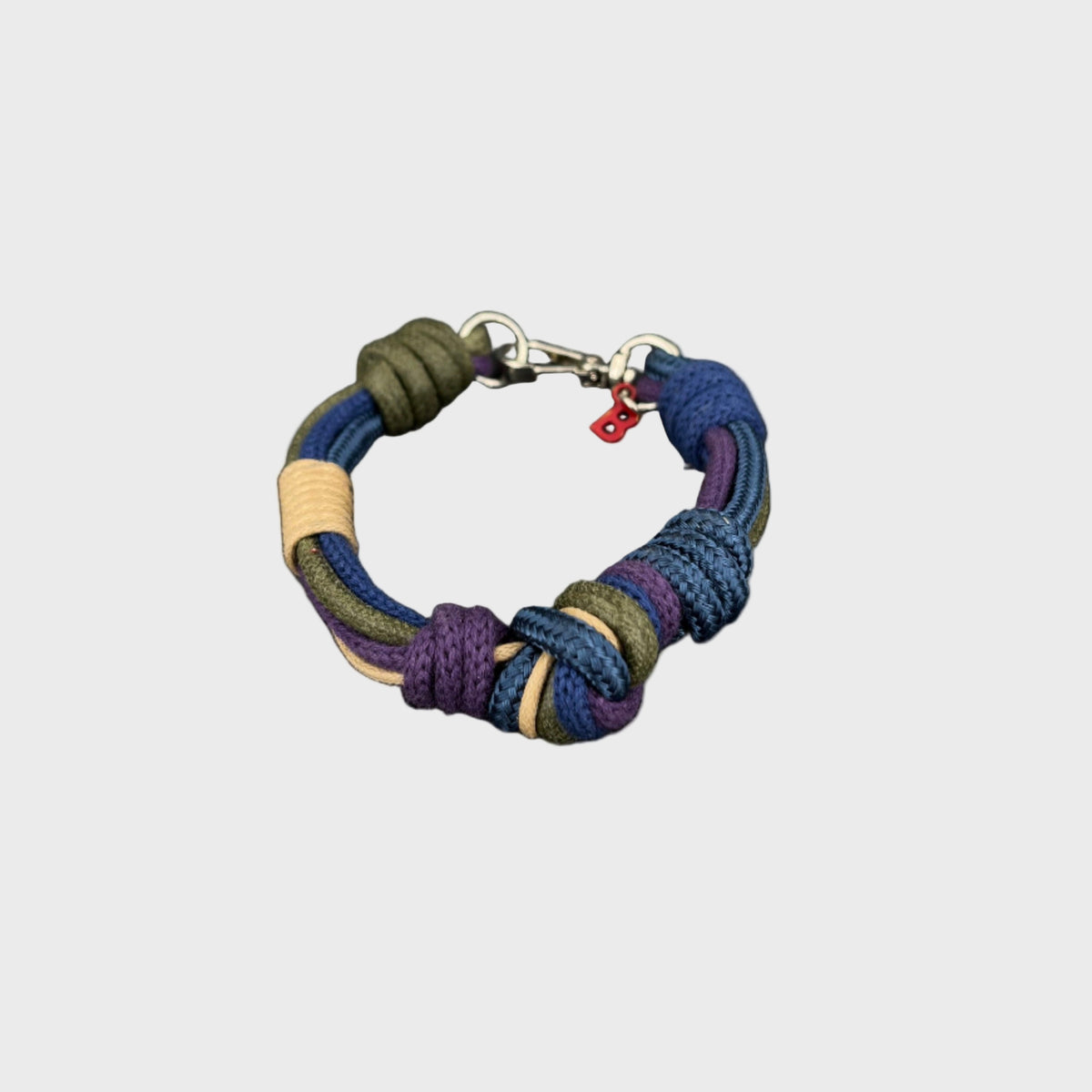 A purple, blue and green macramé bracelet.