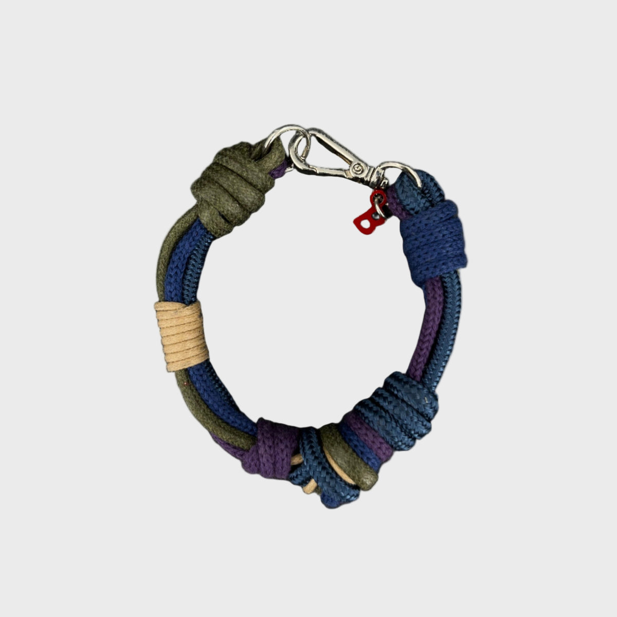 A blue, green and purple macramé bracelet from above.