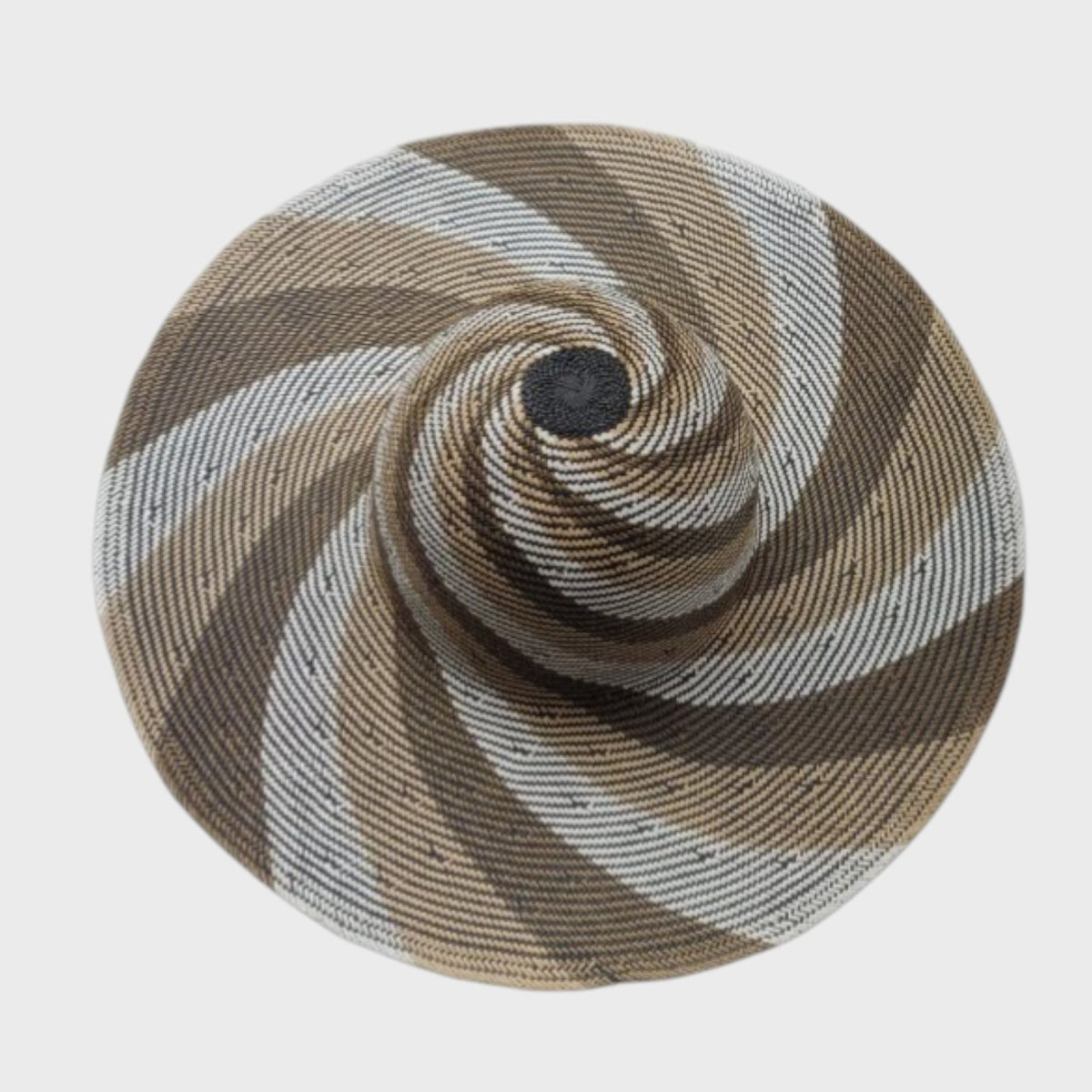 Round wide-brimmed hat with brown and beige spiral pattern on a white background