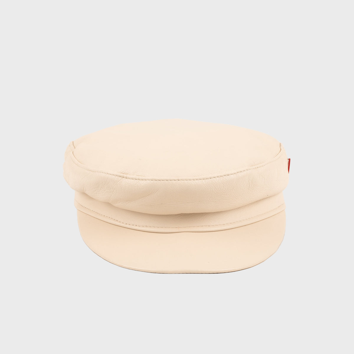 White stewart cap on a light gray background