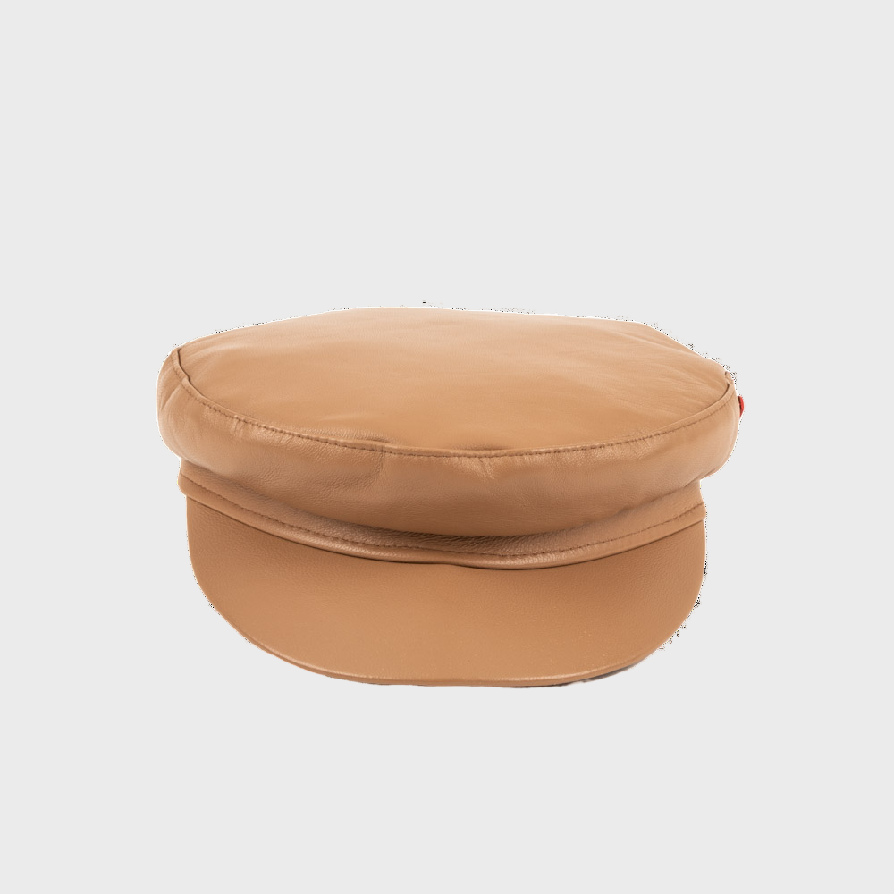 Beige leather stewart cap on a light gray background