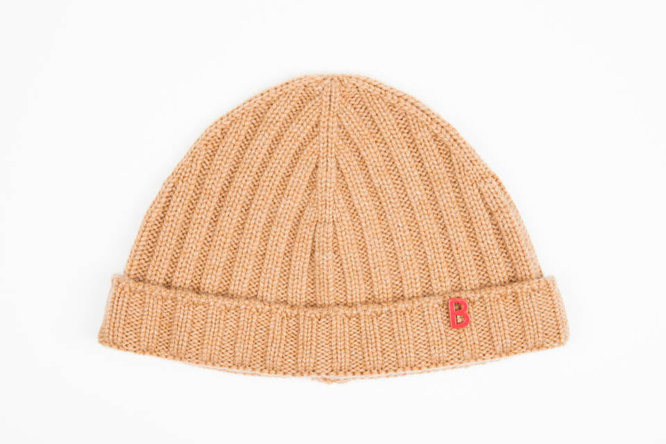 A beige cashmere bonnet.