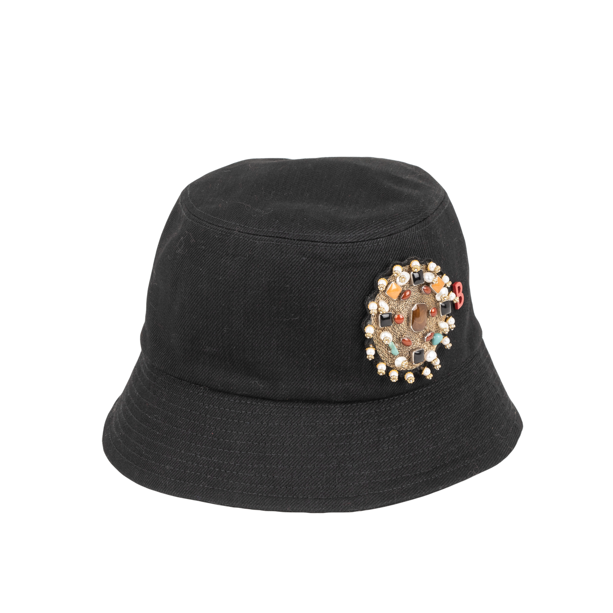 A black cotton bucket hat with a multicolored embroidered brooch representing the inside of a yourte on the front.