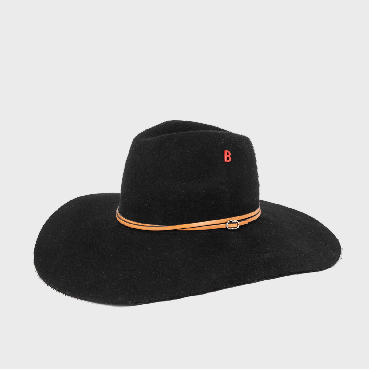 A Black wool hat with a brown leather band and red logo on a light gray background