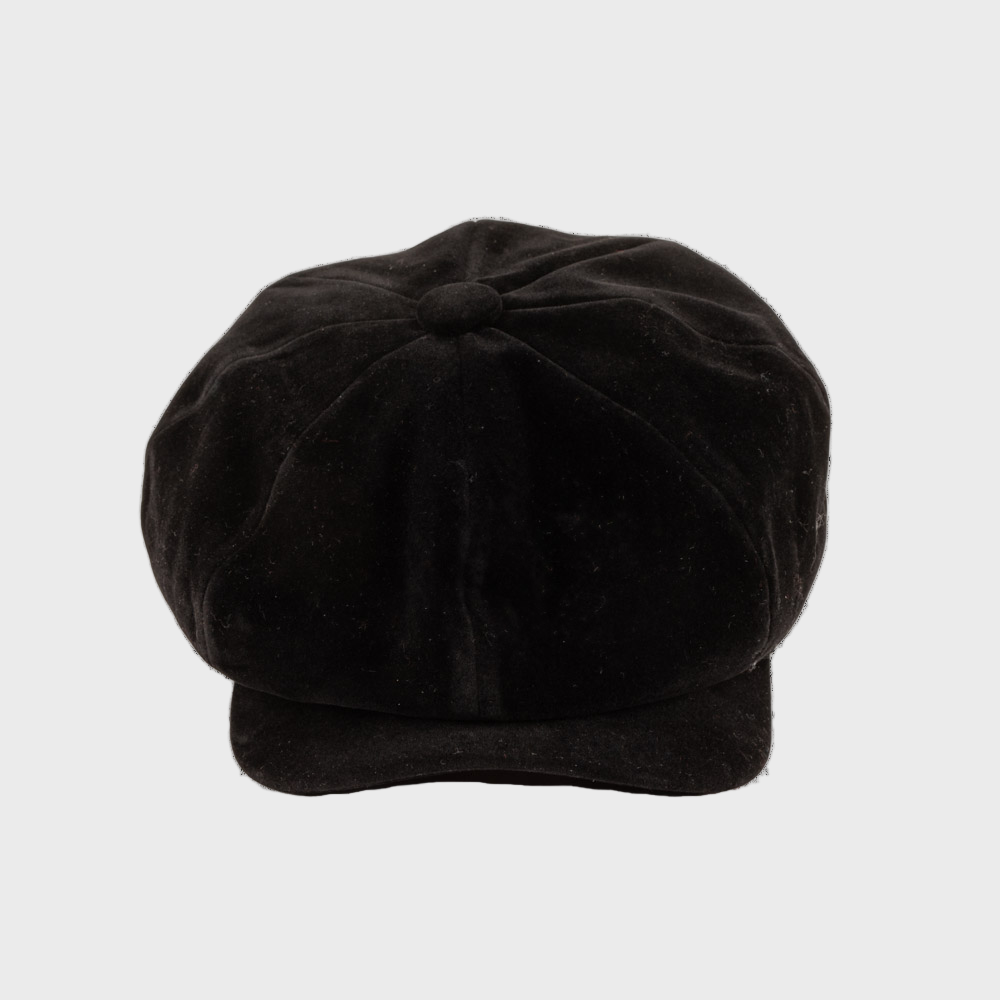 Black velvet cap on a light gray background