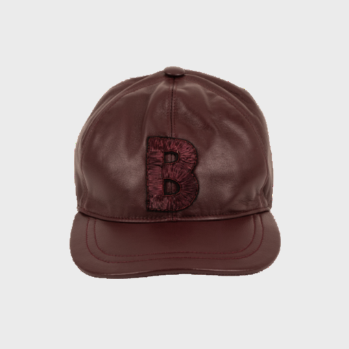 Brown leather cap with a decorative 'B' emblem on a white background