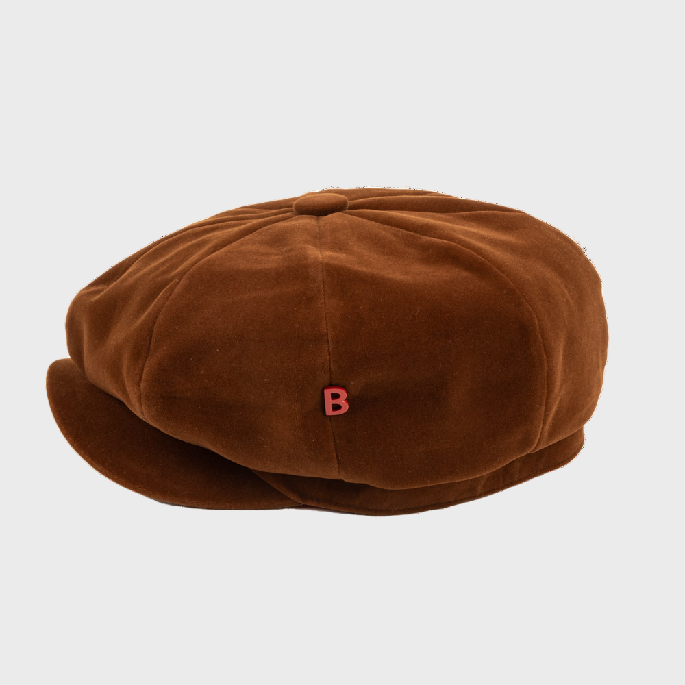 Brown suede leather cap with a red 'B' logo on a light gray background
