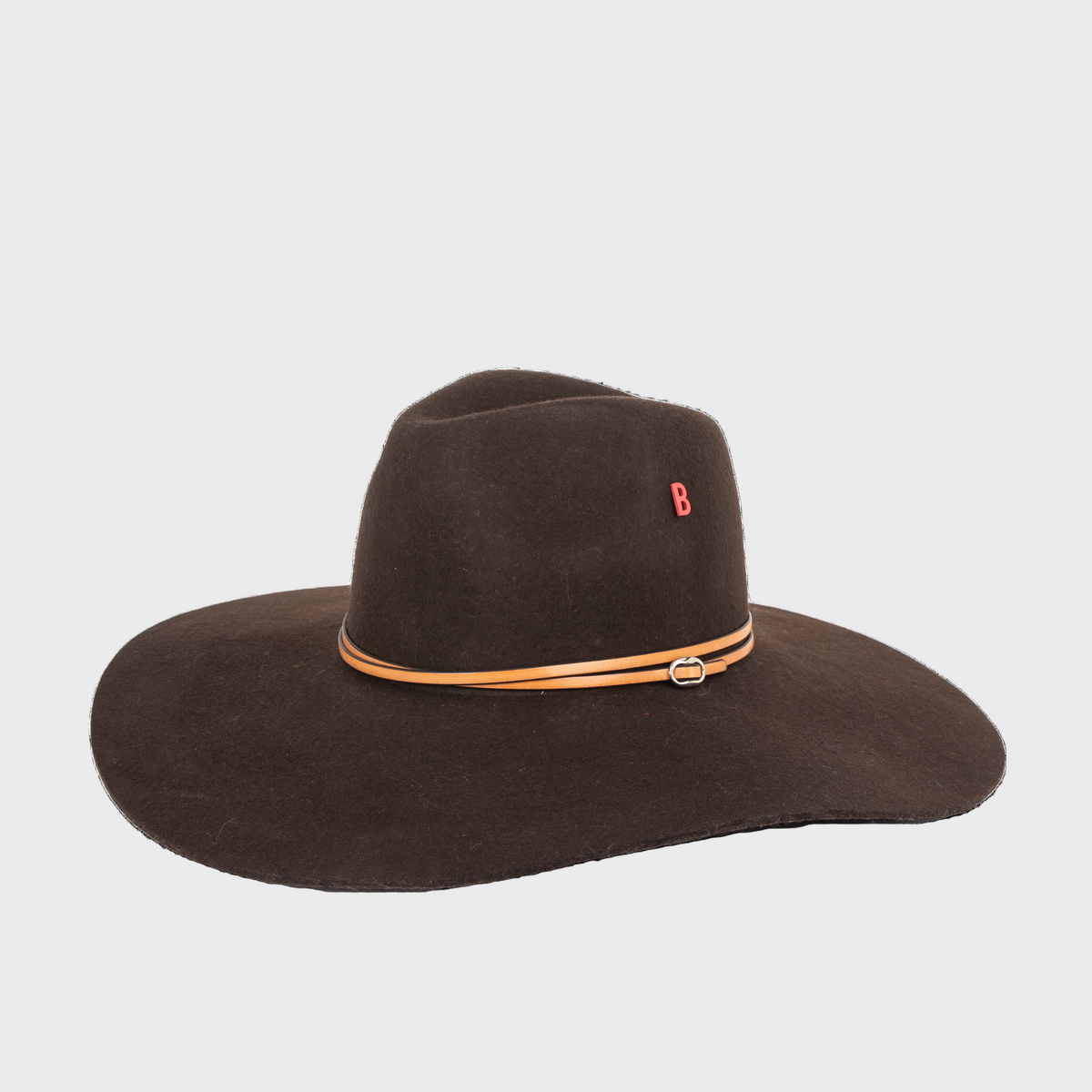 Brown wide-brimmed velvet hat with a brown leather band on a white background