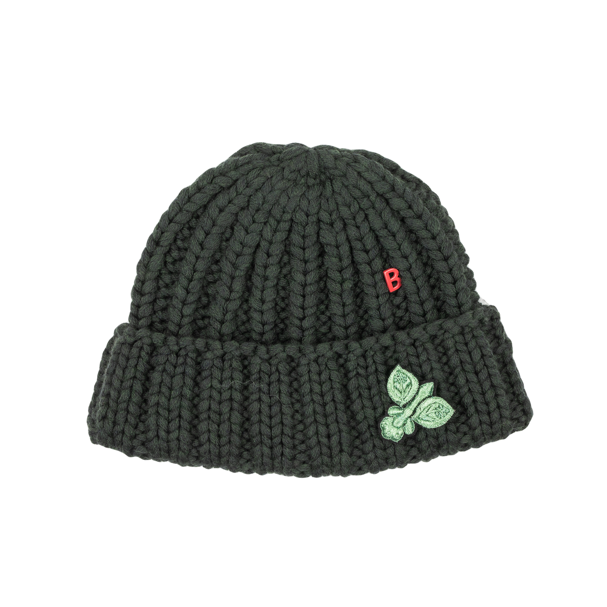 A green hand knitted virgin wool bonnet with a green brooch pinned on it and red logo on the front.