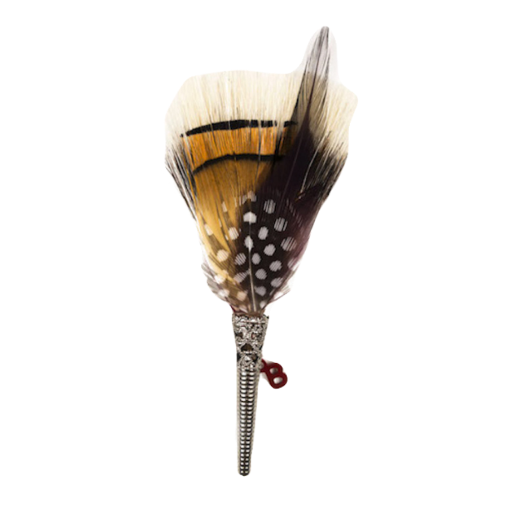 A feather brooch with black and yellow feathers.