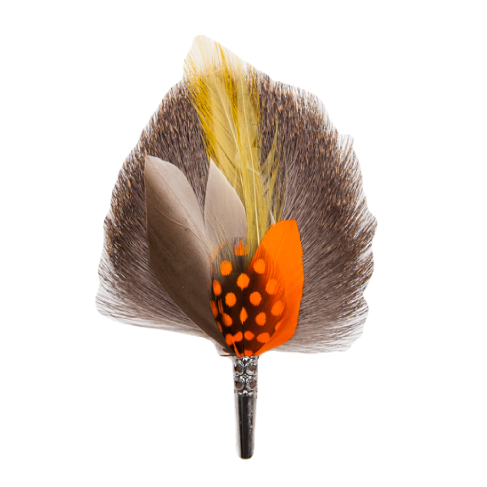 A handmade feather drop brooch with a combination of natural and colored feathers, featuring a prominent orange and yellow feathered section with a black bristle base.