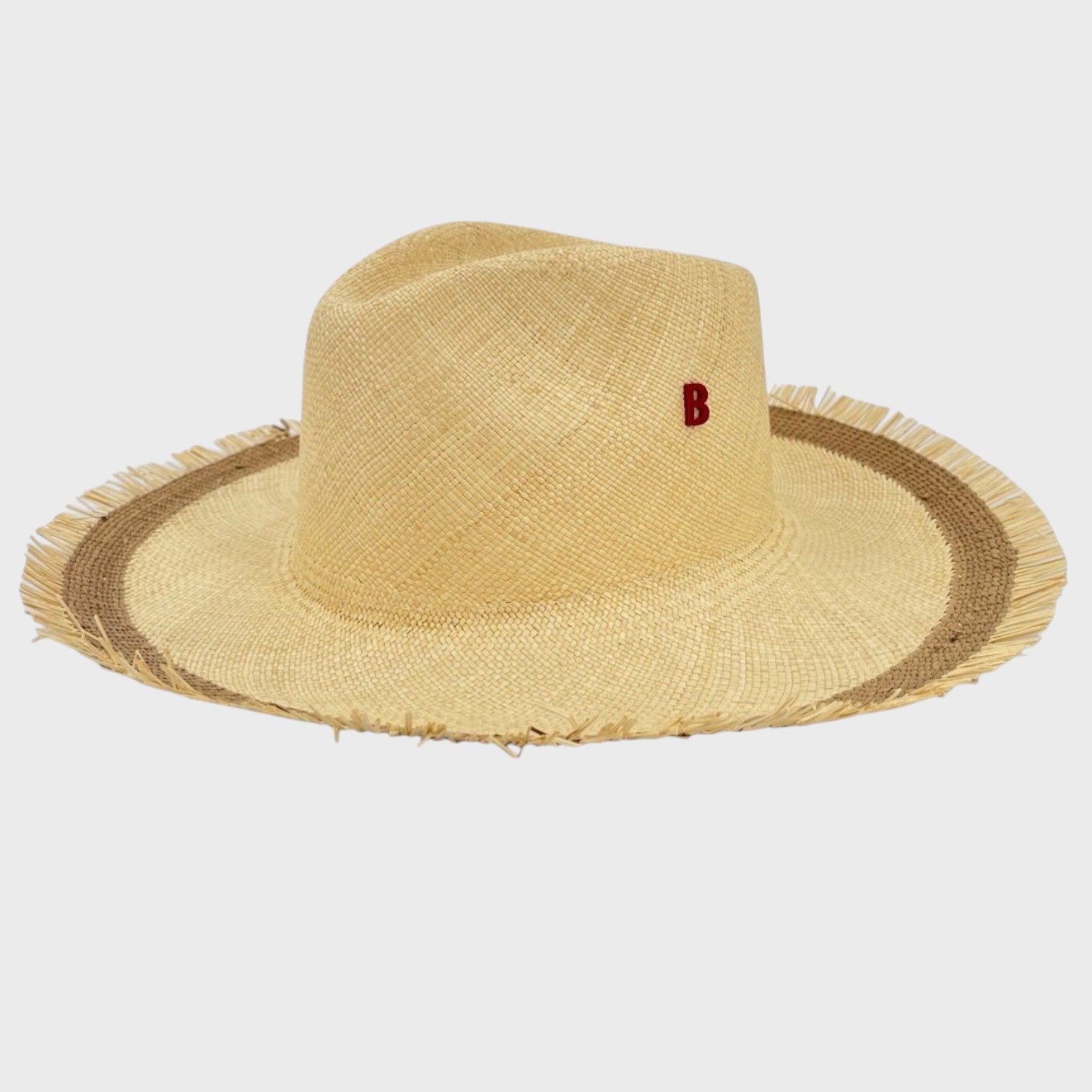 A beige and brown panama straw hat. 