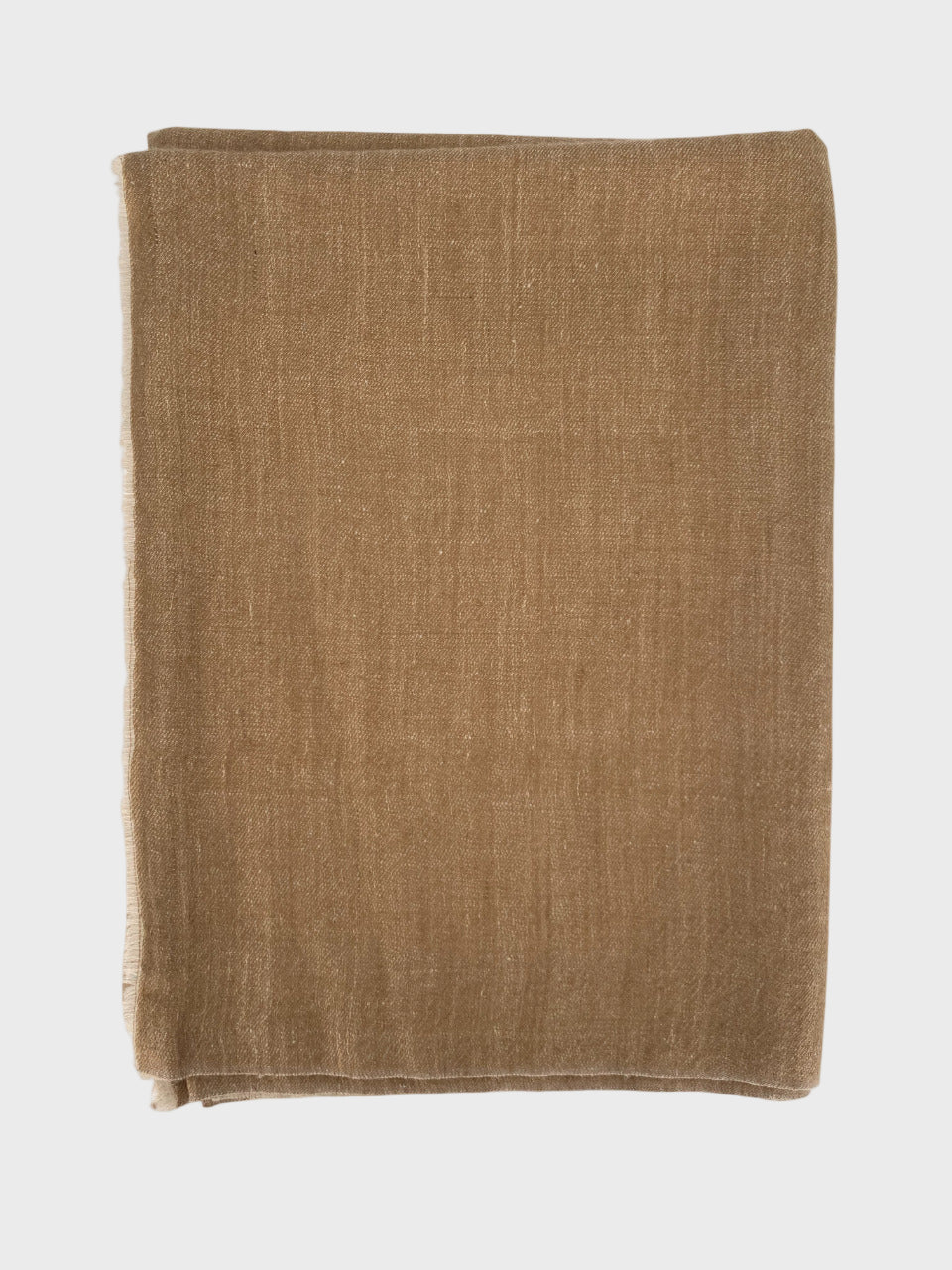 Beige cashmere shawl folded on a white background