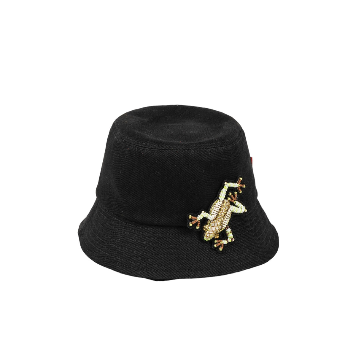 A black cotton bucket hat with a dendrobate embroidered brooch on the front.