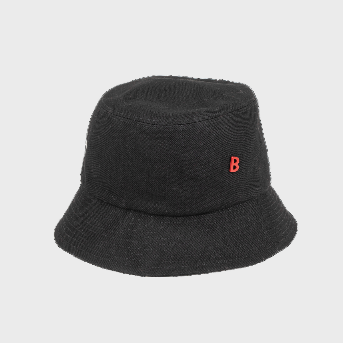 A black cotton bucket hat on a white background. 