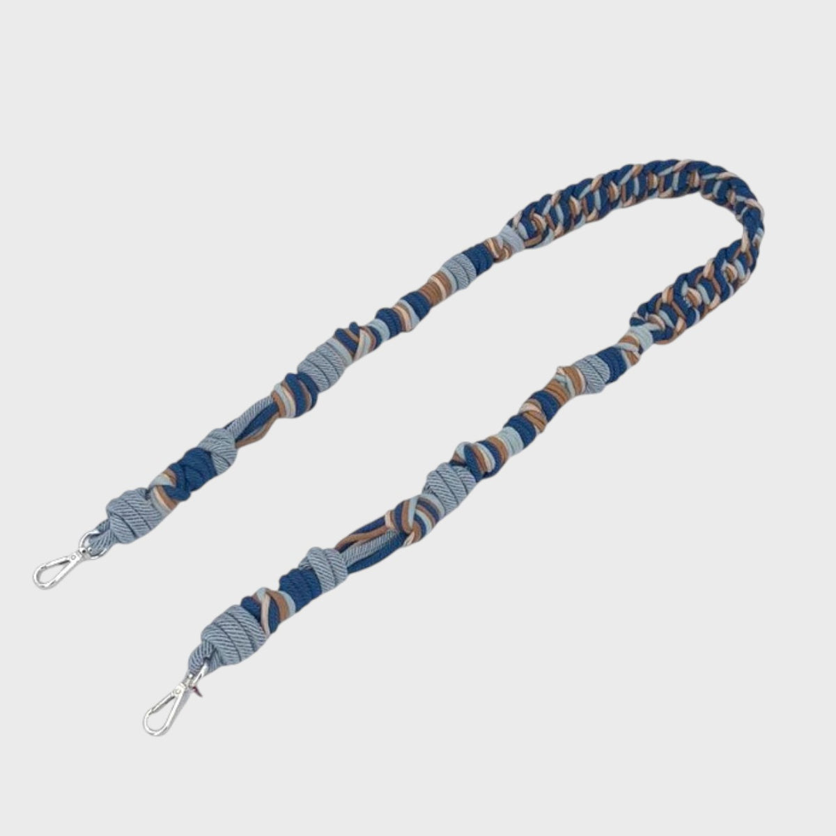 Blue and gray braided bag strap on a light gray background