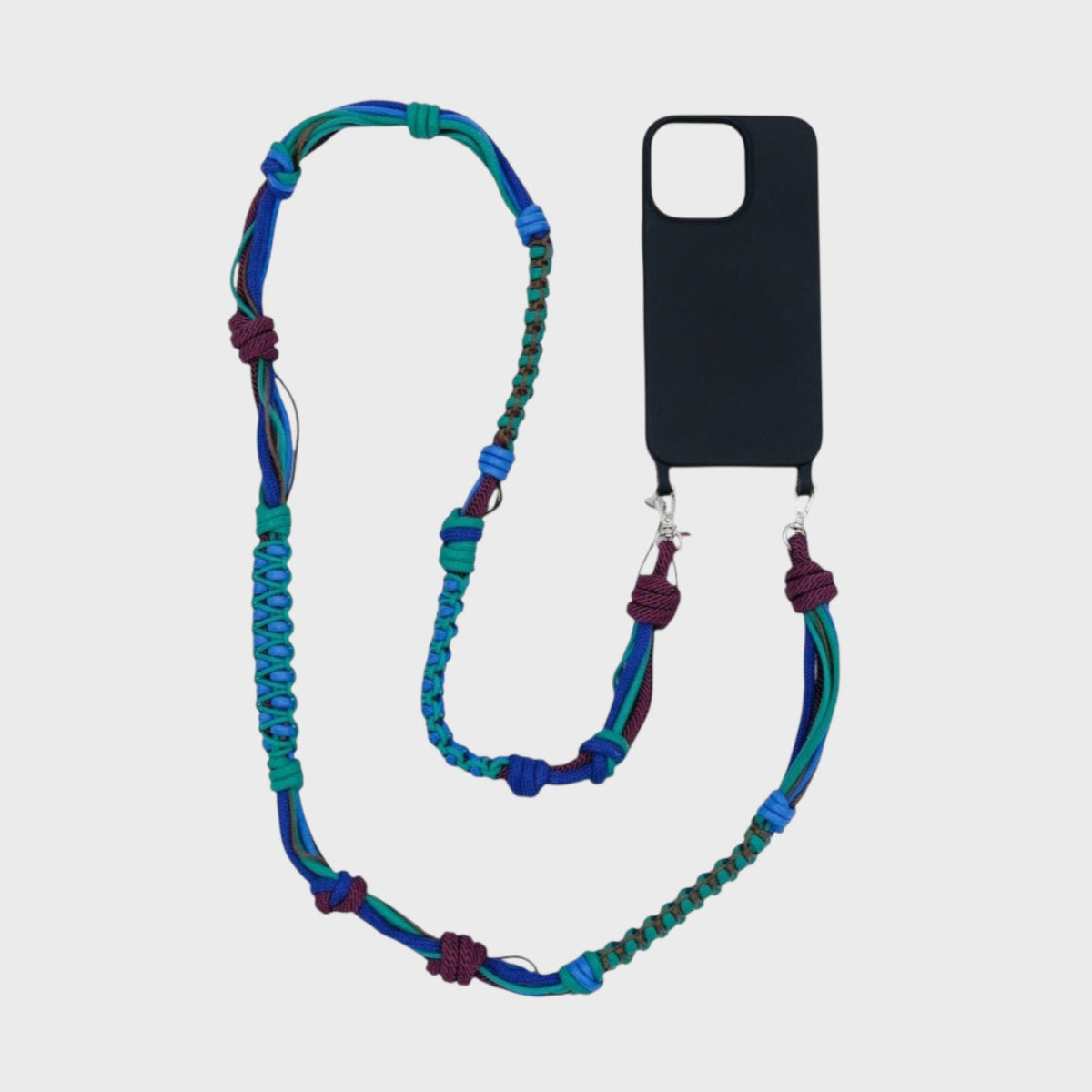Blue, green and purple braided macramé phone lanyard with a black phone case on a light gray background