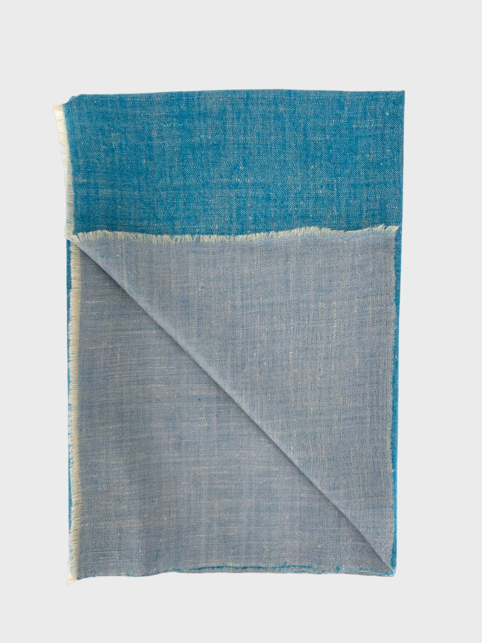 Folded cashmere shawl with blue and gray on a white background