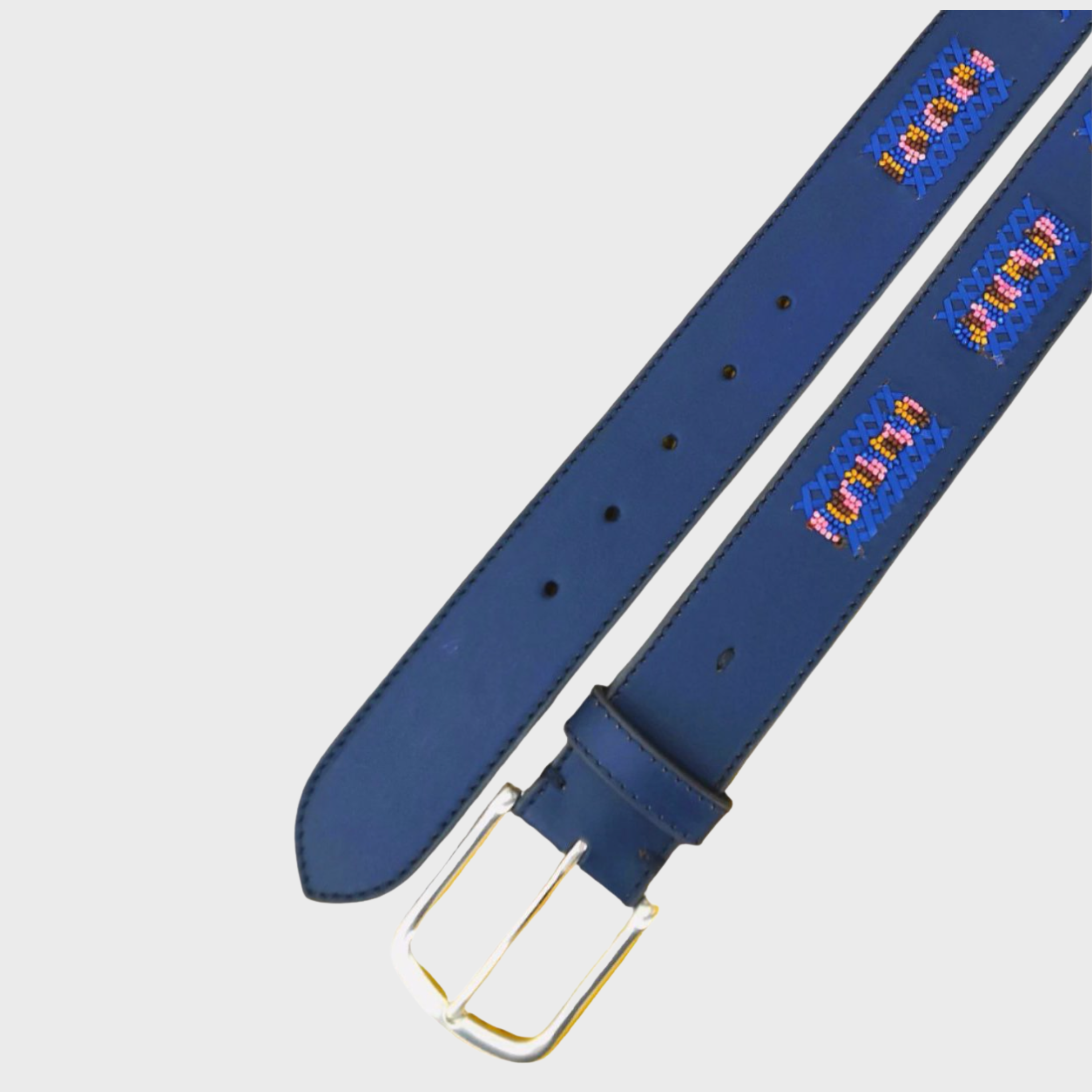 A blue leather belt with a silver buckle, featuring turquoise, pink, and yellow geometric embroidered patterns along the strap.