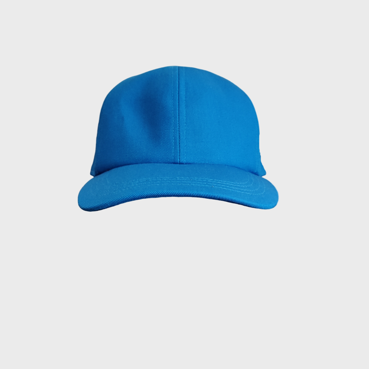A cotton blue baseball cap facing the camera. 