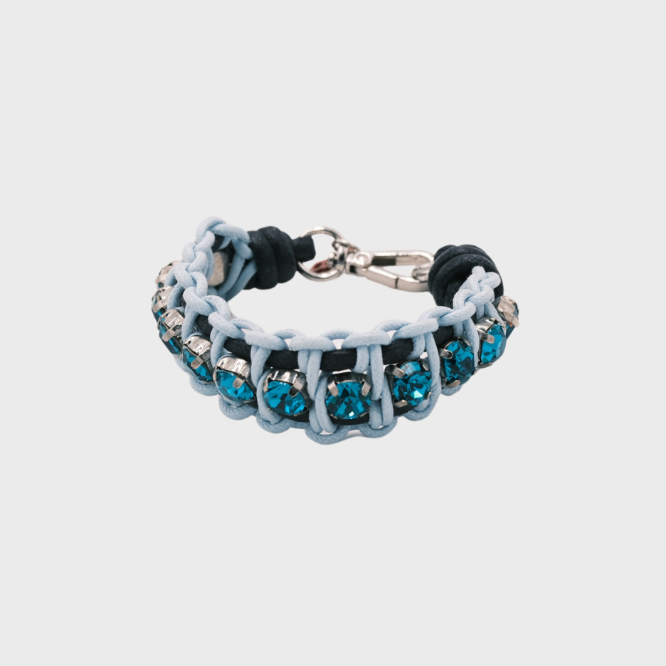 A braided macramé bracelet featuring blue cords with small blue beads.