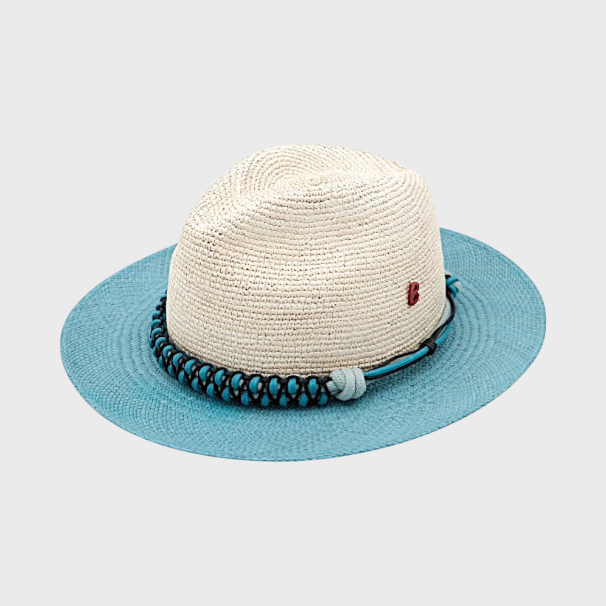 A raffia white and blue tuilerie hat with a blue macramé woven hatband. 